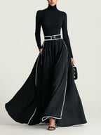 San Sebastian | Vestido Maxi Negro con Costuras Blancas y Cuello Alto