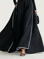 San Sebastian | Vestido Maxi Negro con Costuras Blancas y Cuello Alto