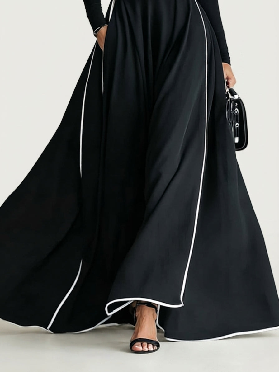 San Sebastian | Vestido Maxi Negro con Costuras Blancas y Cuello Alto
