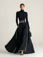 San Sebastian | Vestido Maxi Negro con Costuras Blancas y Cuello Alto