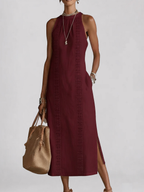 Alessandra | Vestido midi sin mangas blanco con detalles bordados y bolsillos laterales