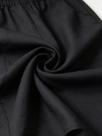 Marbella | Mono negro casual con hombros al aire y cordón ajustable