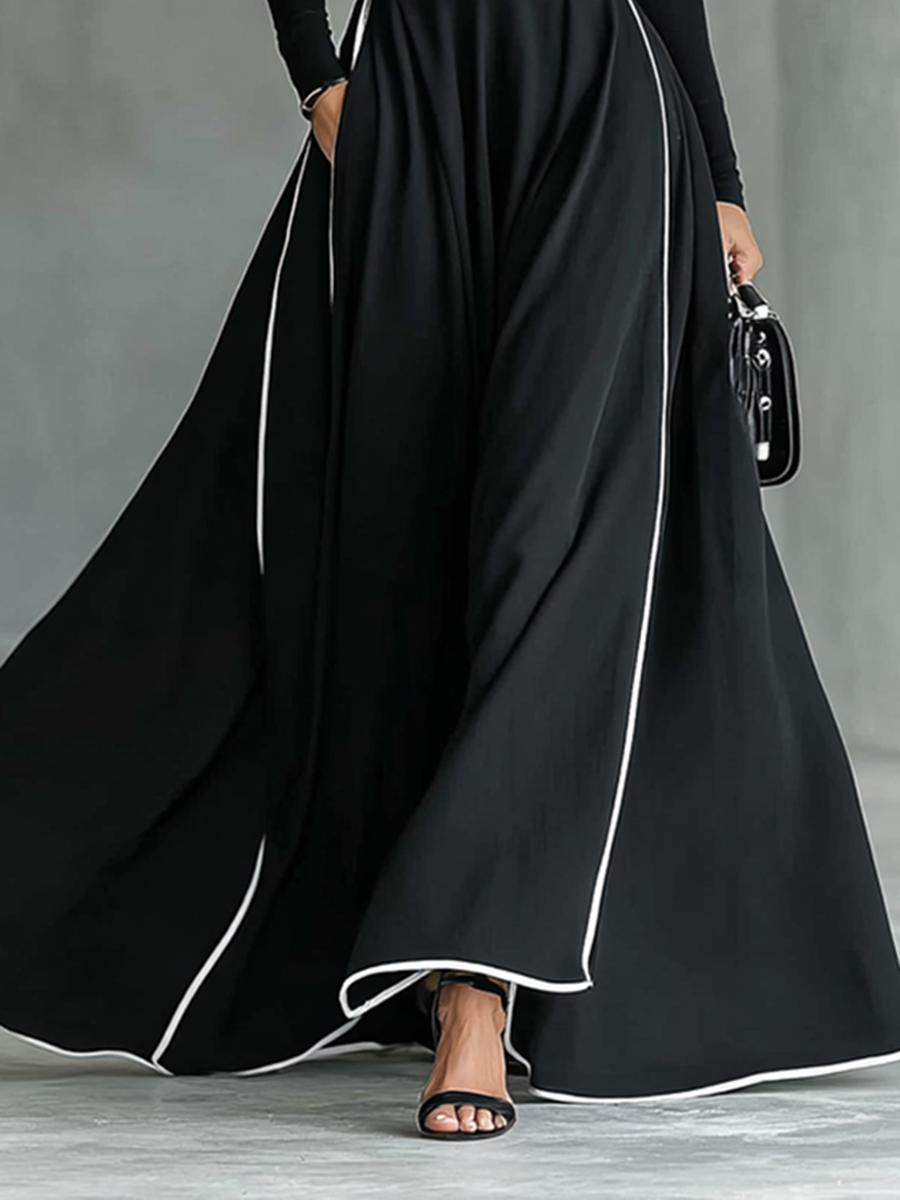 Albarracín – maxivestido negro con costuras blancas y cuello alto